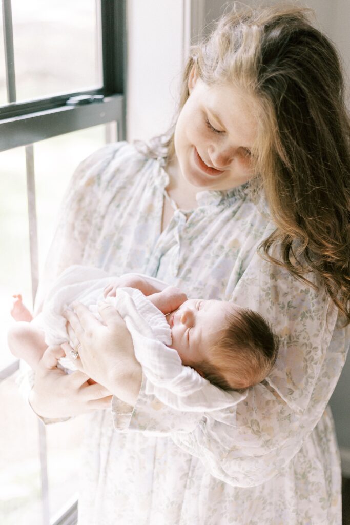 mom holding newborn baby