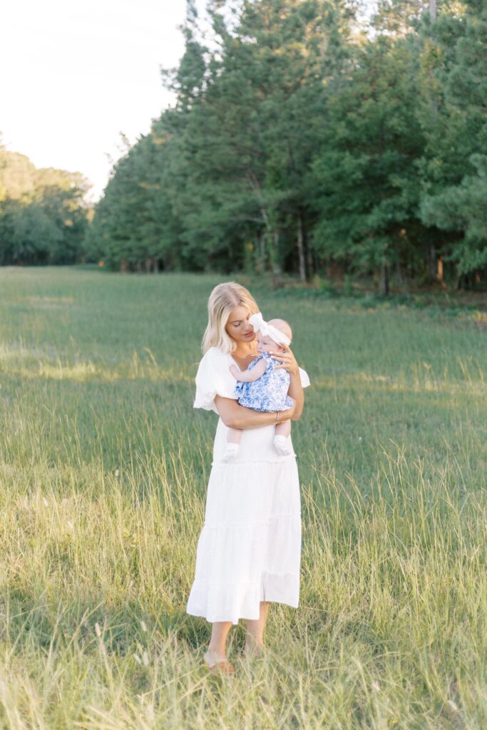 mom and baby photos in green field