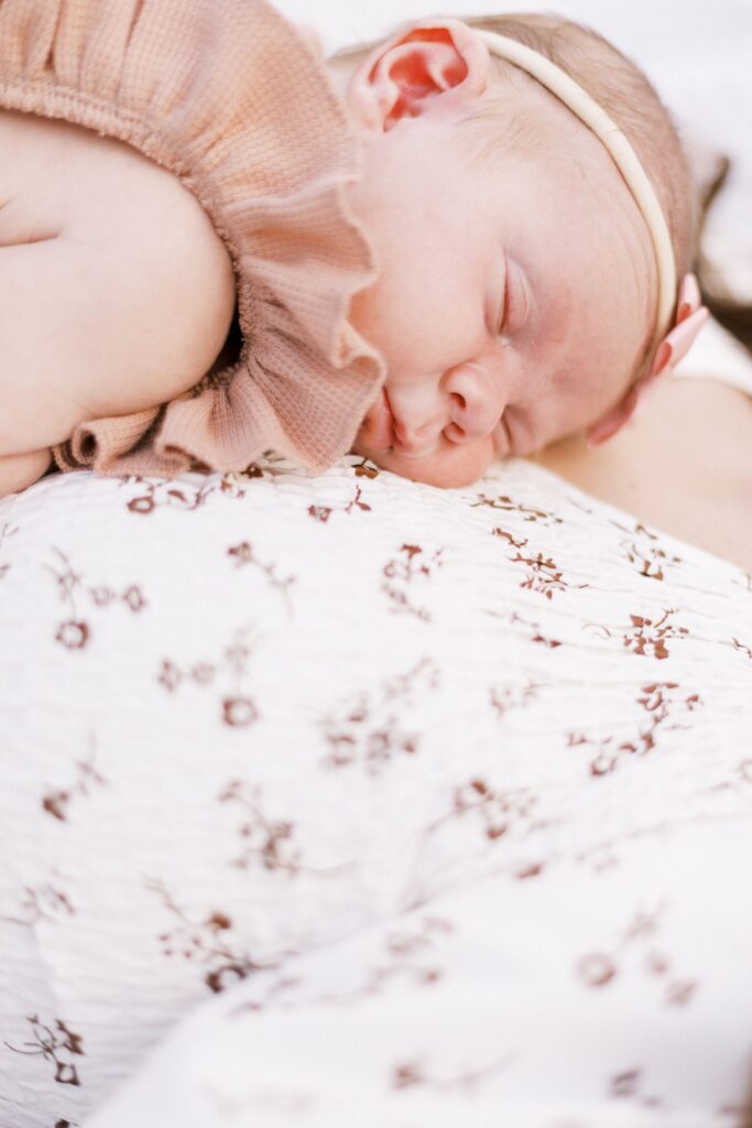 outdoor newborn photos in a field