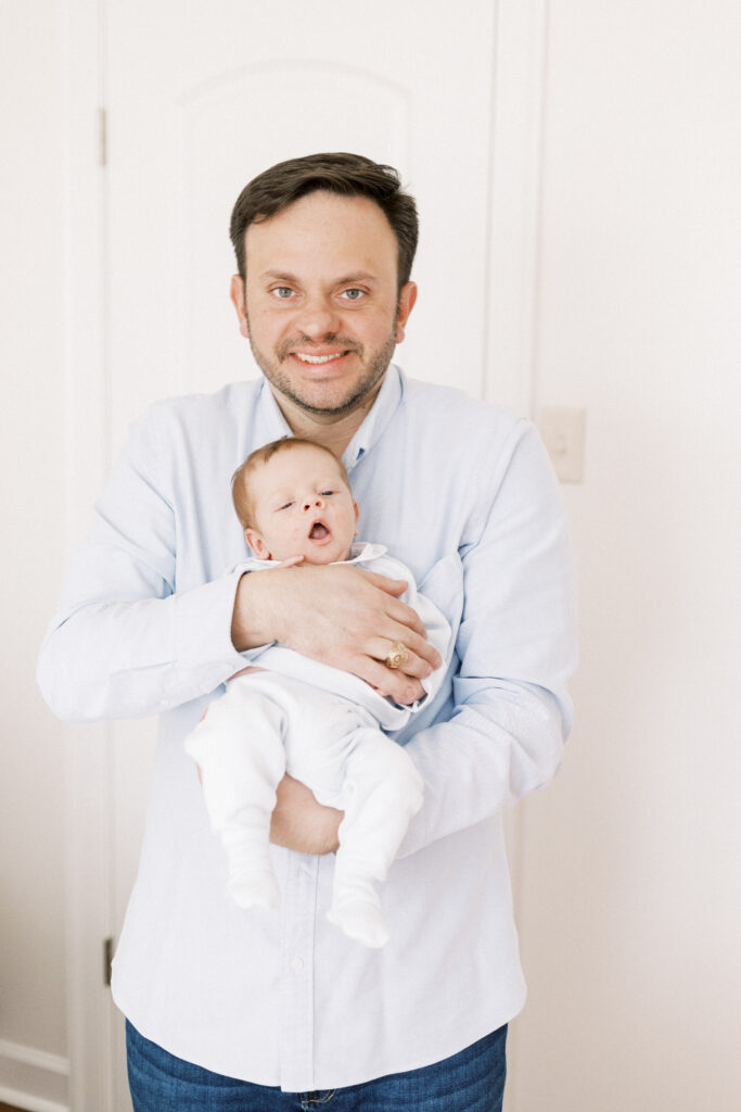 dad holding newborn baby