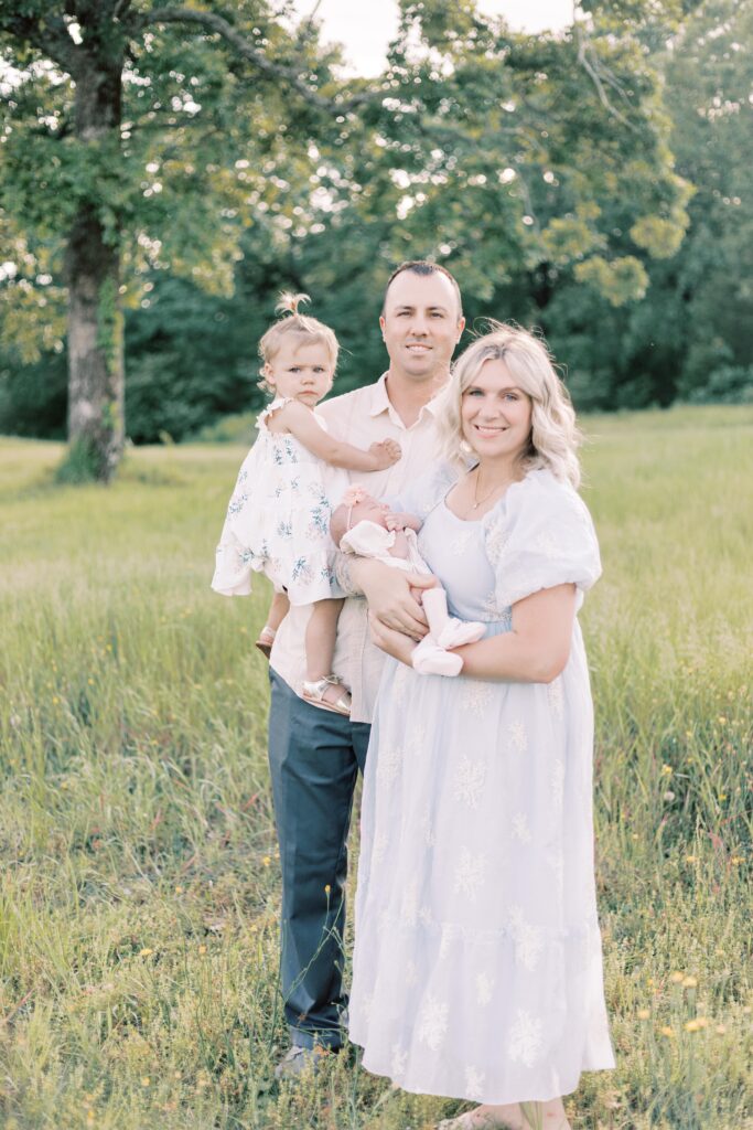 family smiling in peoria illinois outdoor newborn photos
