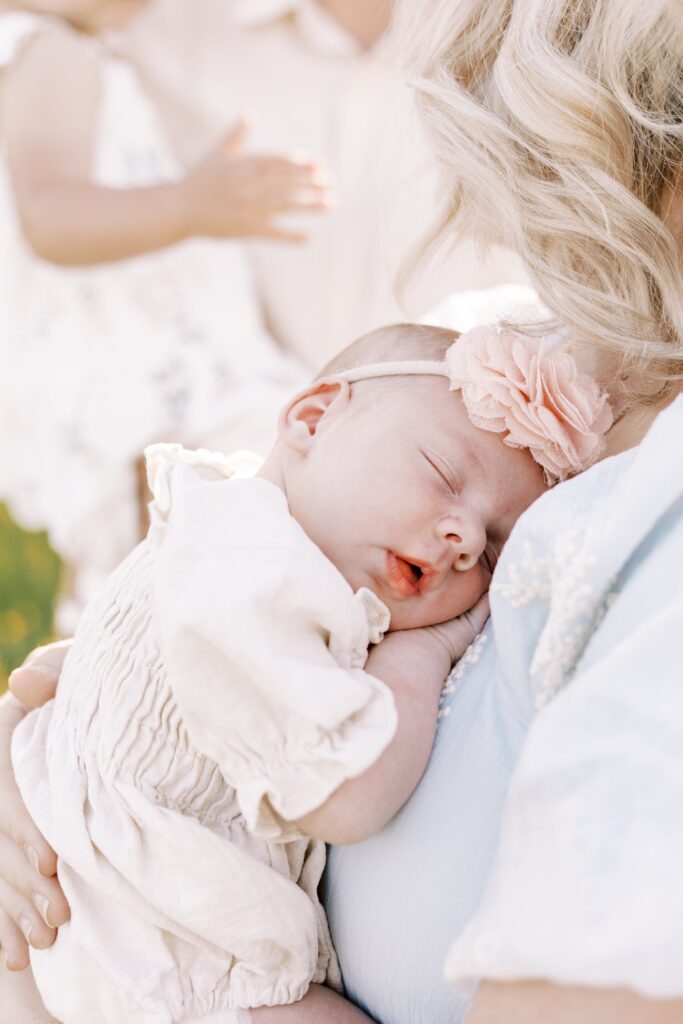 baby sleeping on mom in peoria illinois newborn photos