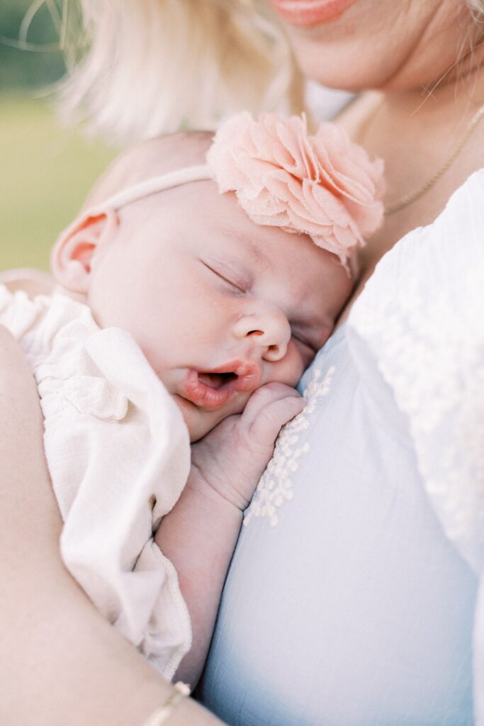 newborn baby sleeping on mom during peoria illinois newborn photos