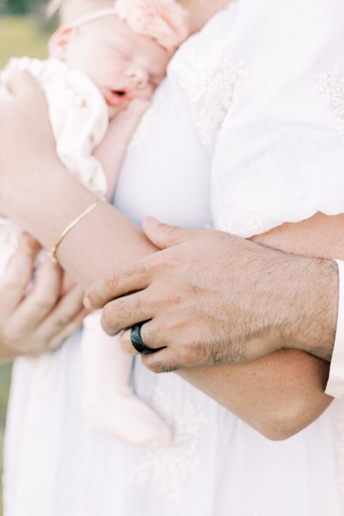 husband's hand on wife during peoria illinois newborn photos