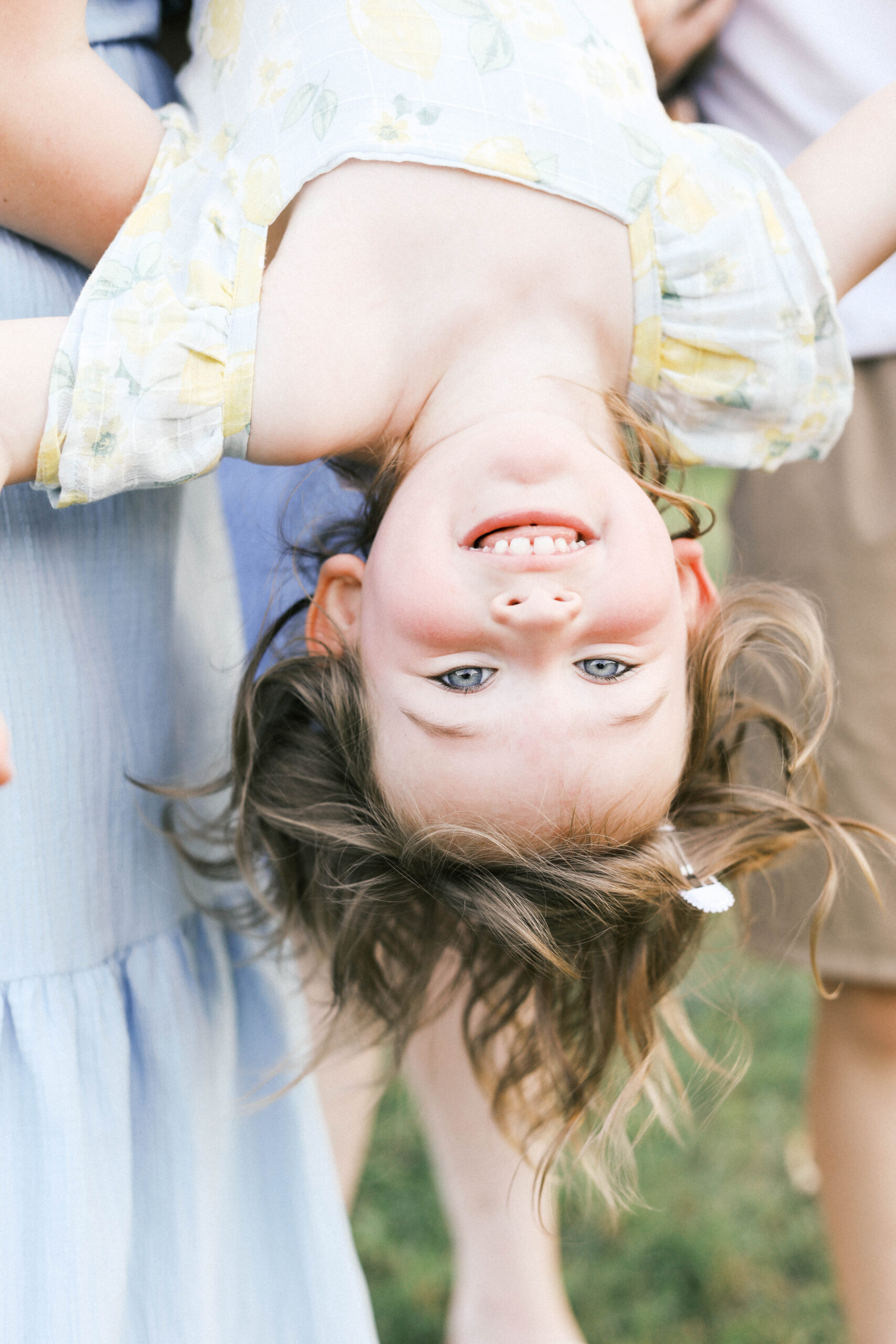 child being tipped upside down during peoria illinois photos