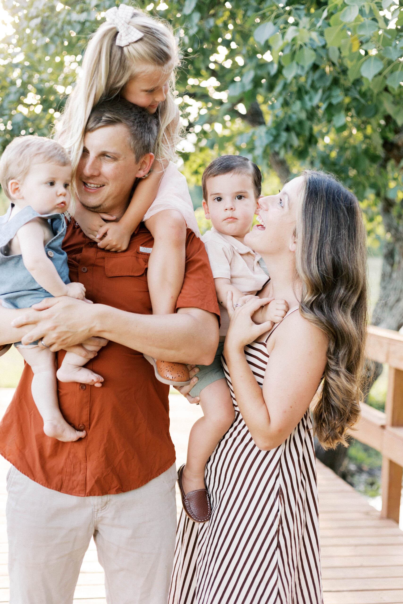 family of 5 hugging and smiling in peoria il family photos
