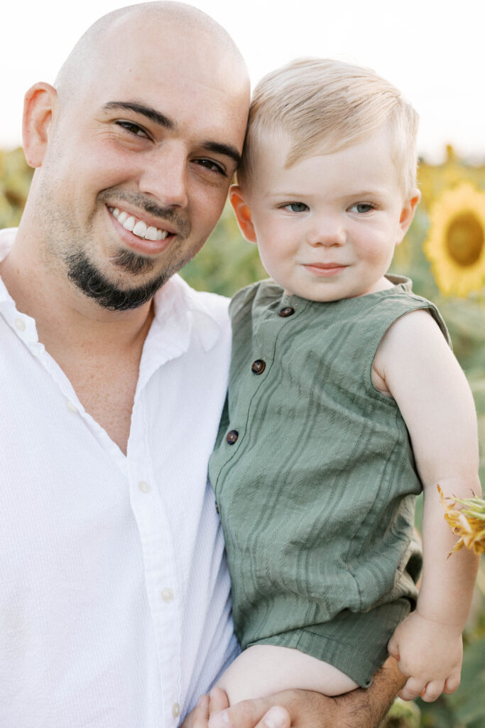 dad and son smiling during peoria il sunflower family photos