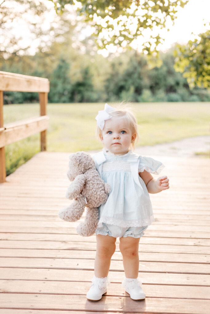 one year old baby milestone photos with stuffed animal