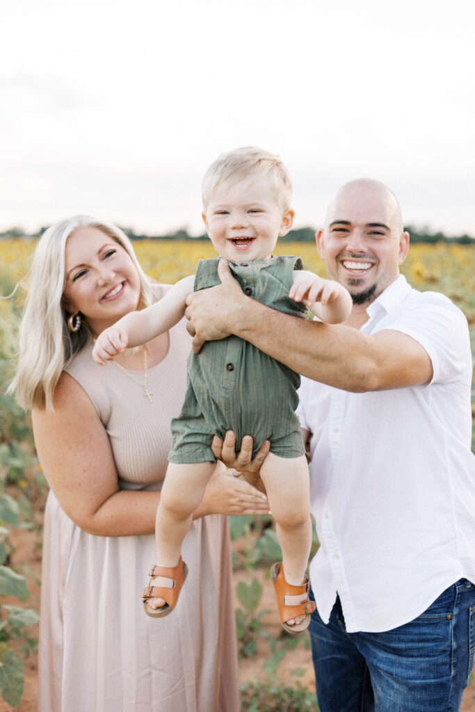 baby smiling during family sunflower photos in peoria il