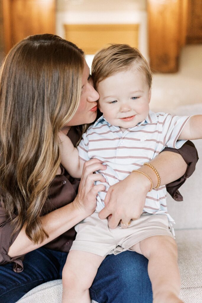 mom hugging baby in one year milestone peoria il photos