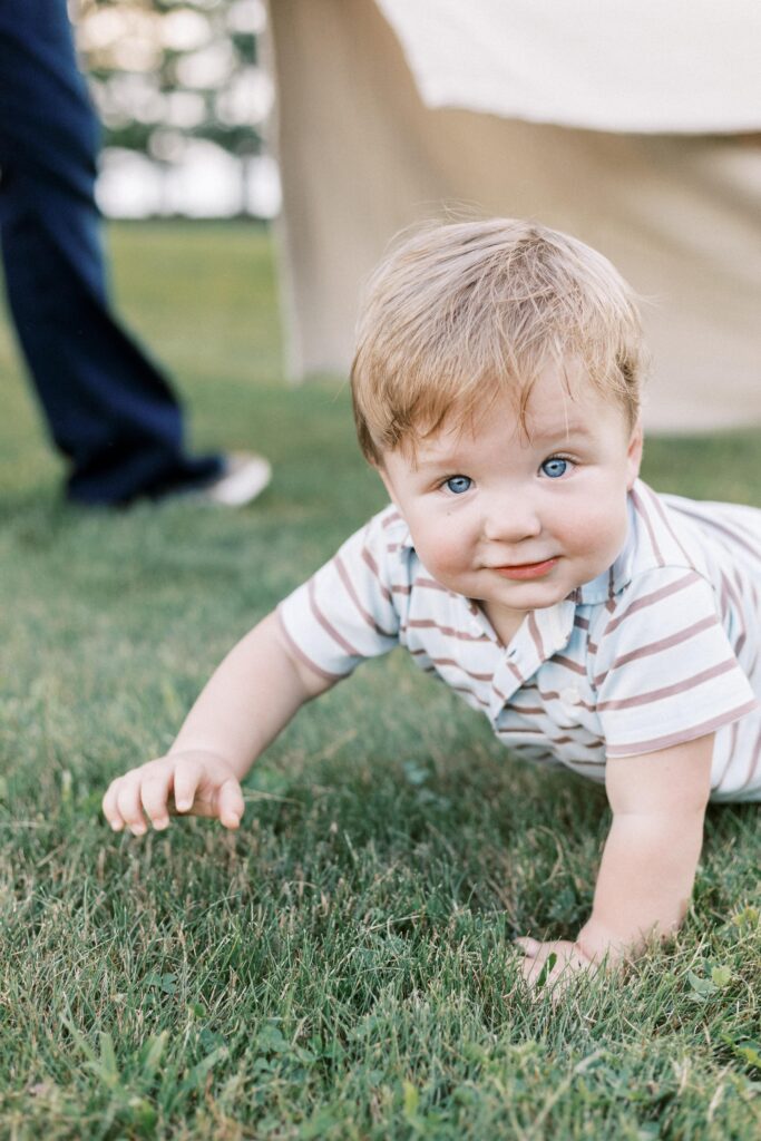 toddler crawling during family photos in peoria illinois