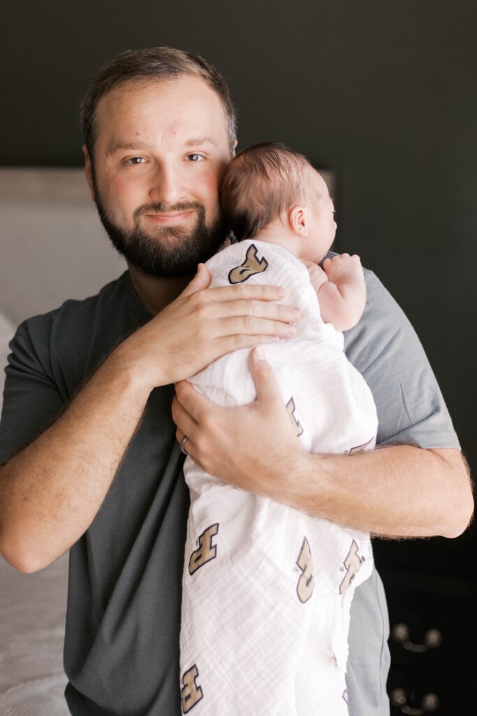 Peoria newborn photographer captures baby in nursery