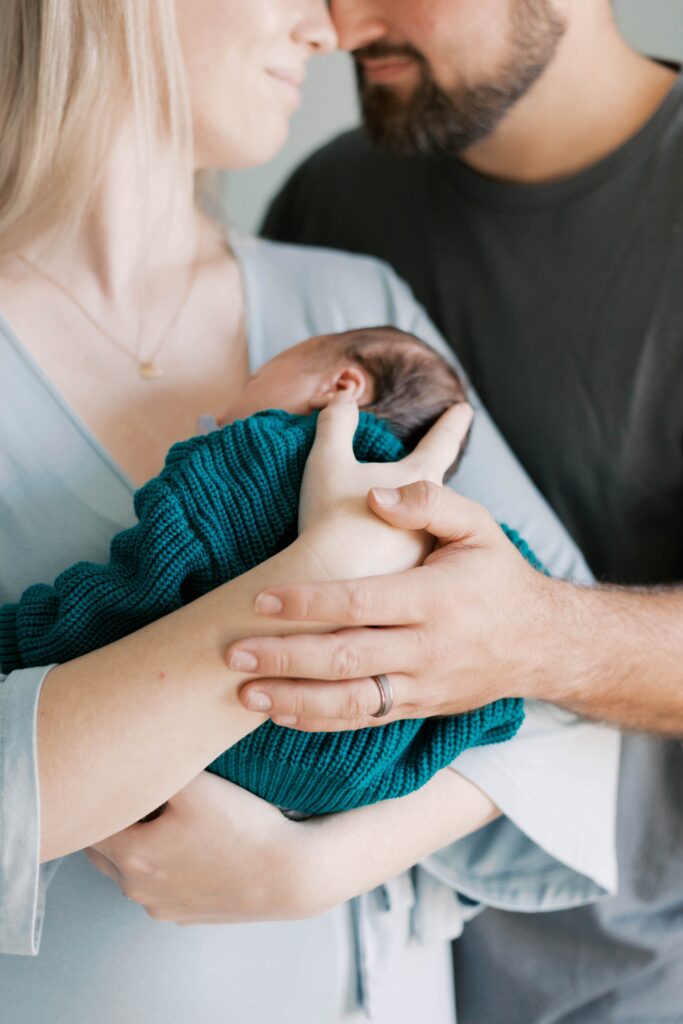 Peoria newborn photographer captures baby in nursery