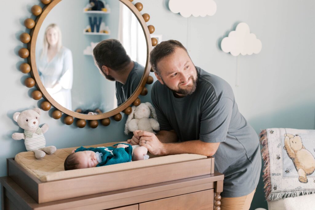 Peoria newborn photographer captures baby in nursery