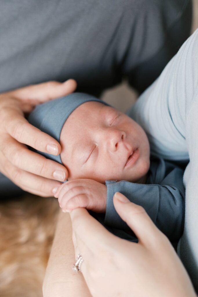 Peoria newborn photographer captures baby in nursery