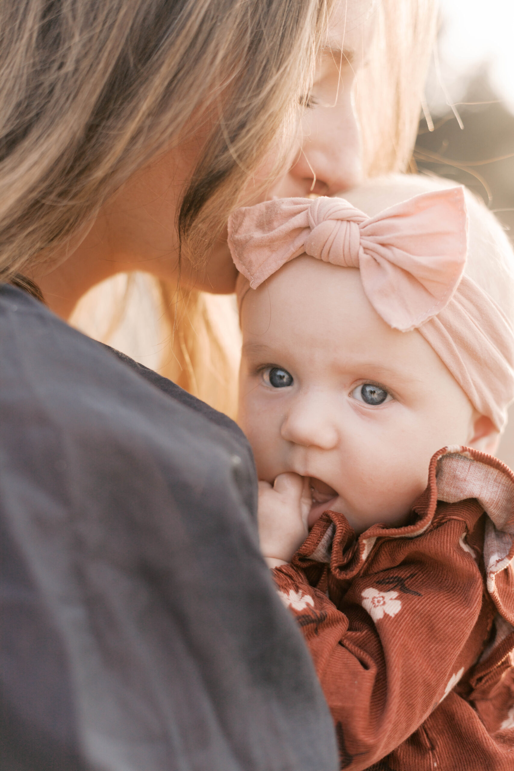 mom hugging her baby in fall peoria il family photos