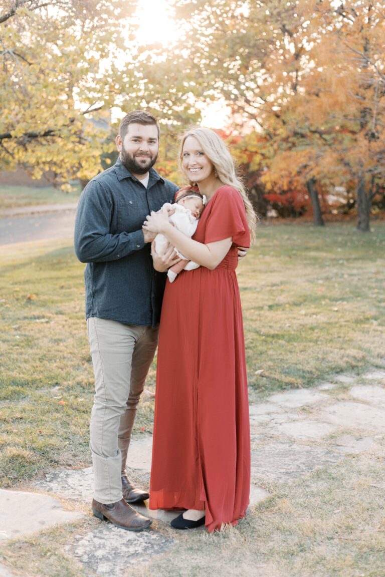 peoria illinois newborn photographer-37 copy-min parents holding daughter during newborn photos in peoria illinois