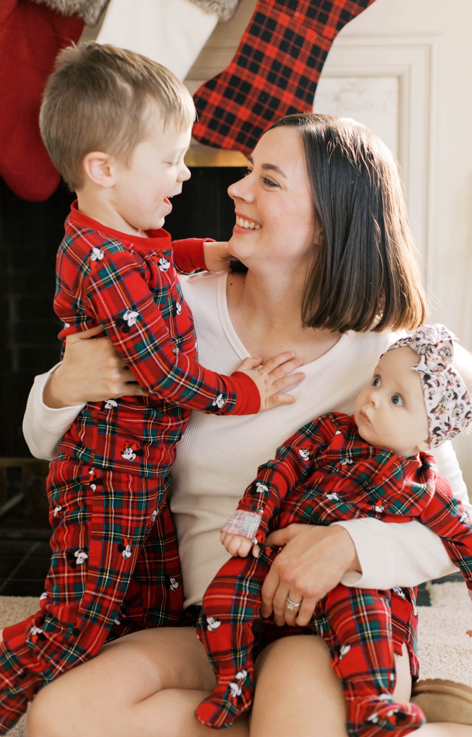 Candid family moment during in-home Christmas photo session in Peoria IL