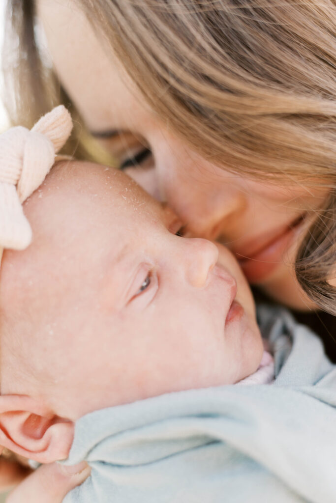 newborn photographer peoria il -26 Mom snuggling newborn baby in peoria il newborn photos