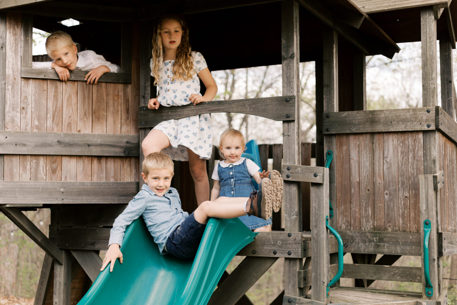 newborn photographer peoria il -43 children playing on playset during peoria il newborn photos