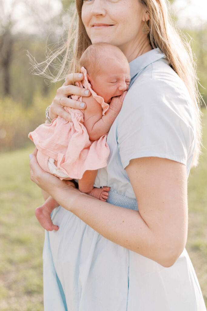 newborn photographer peoria il -64 mom holding newborn on her chest during peoria il newborn photos