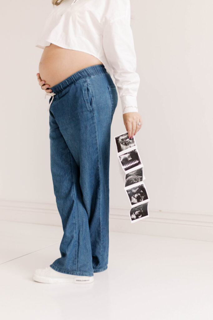 studio maternity photographer peoria il-31 mom holding ultrasound in peoria il studio maternity photos