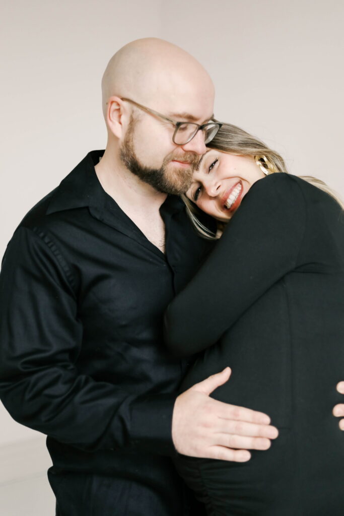 studio maternity photographer peoria il-78 mom and dad wearing all black outfits in peoria il studio maternity photos