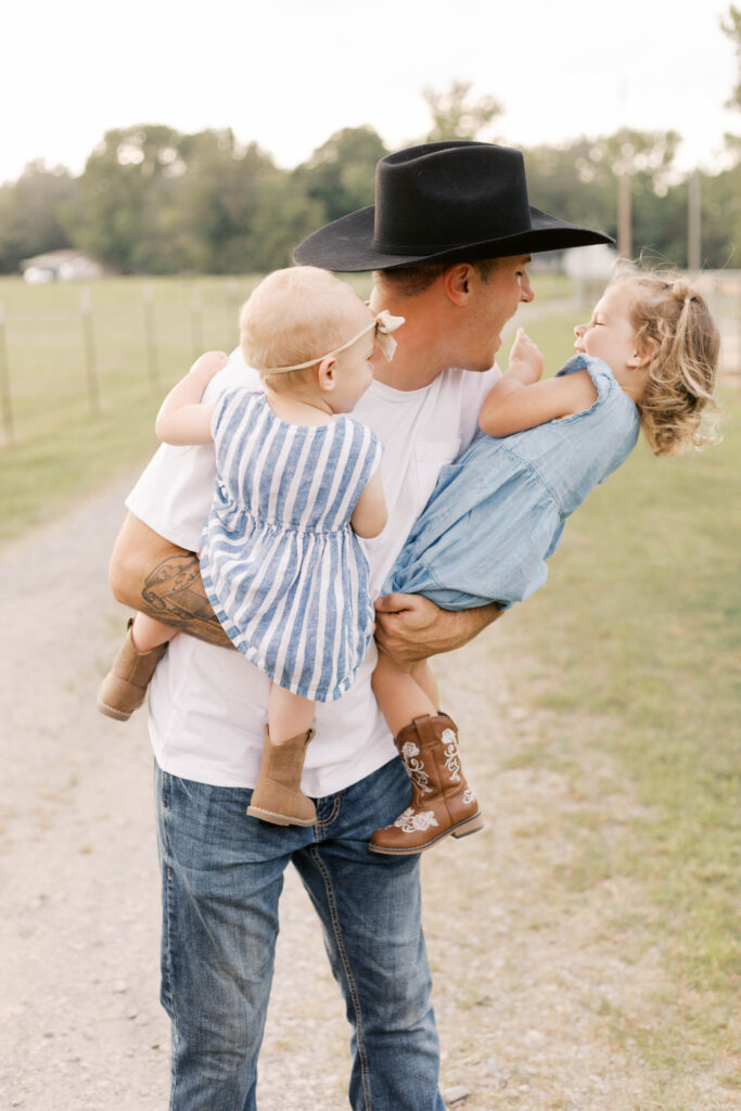 dad playing with daughters in peoria il family photos