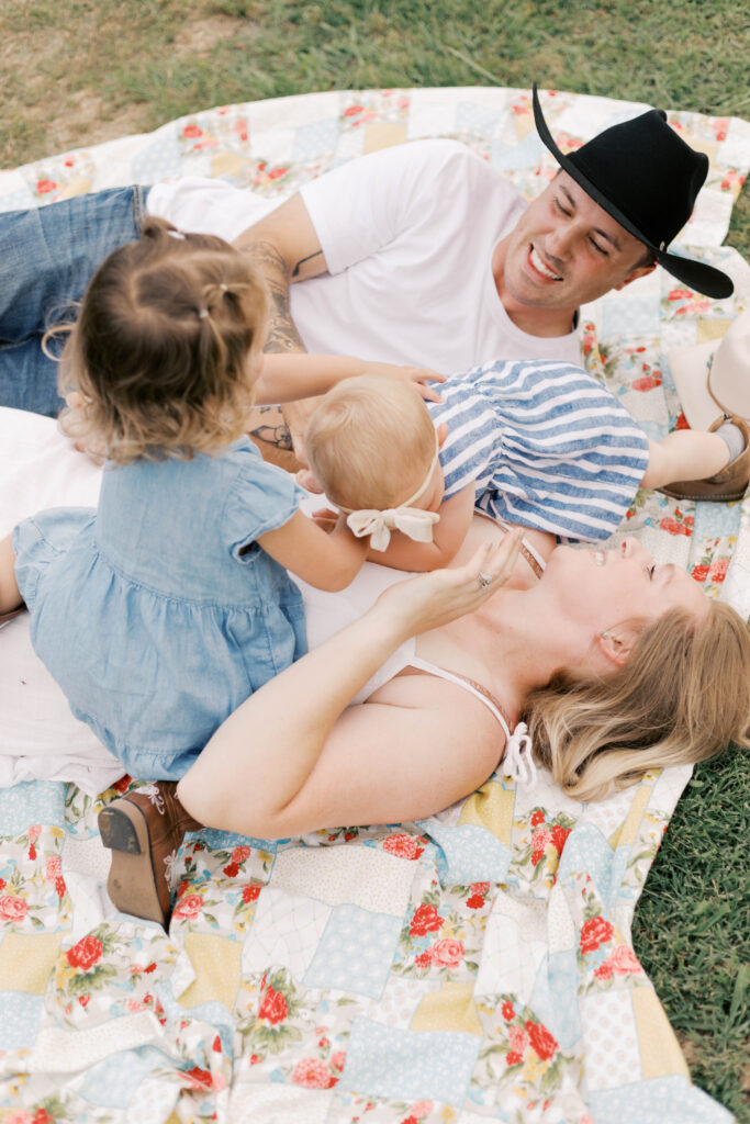 family playing on colorful blanket in peoria il home family photos